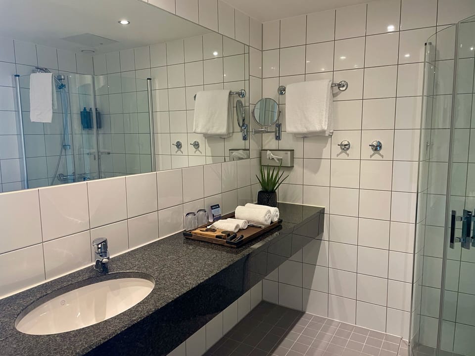 Shower, eco-friendly toiletries, hair dryer, bathrobes