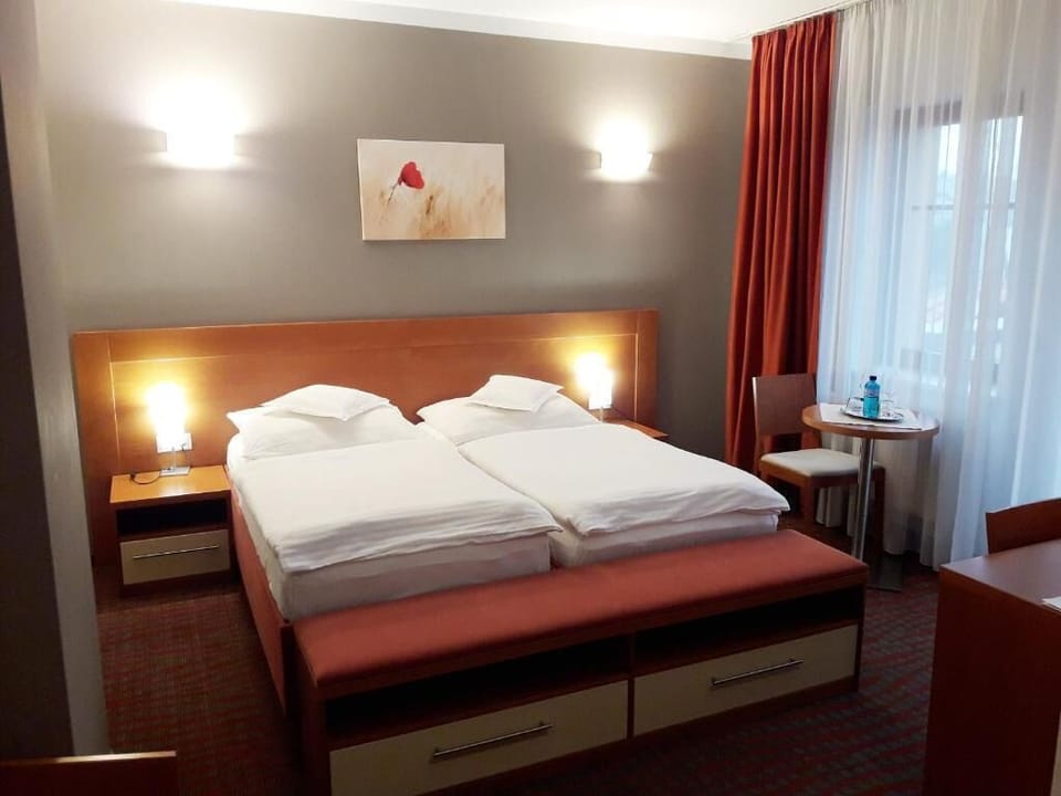 Double or Twin Room | Minibar, in-room safe, desk, blackout drapes