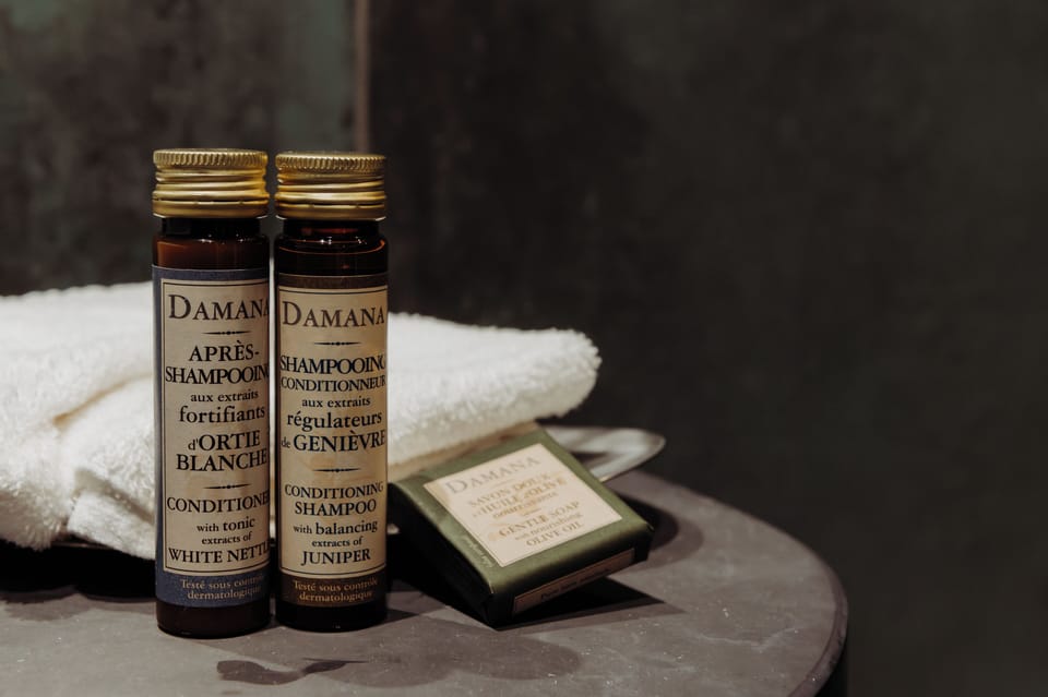 Shower, designer toiletries, hair dryer, towels