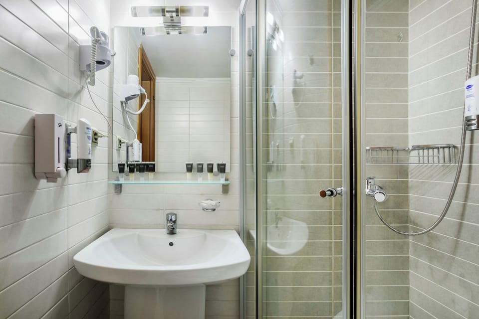 Shower, free toiletries, hair dryer, slippers