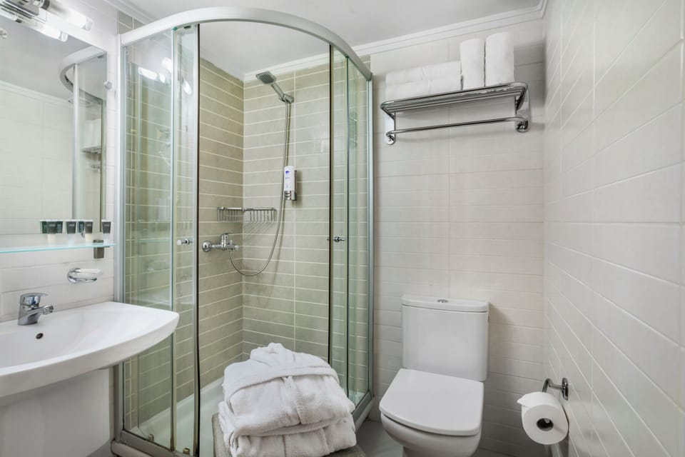 Shower, free toiletries, hair dryer, slippers