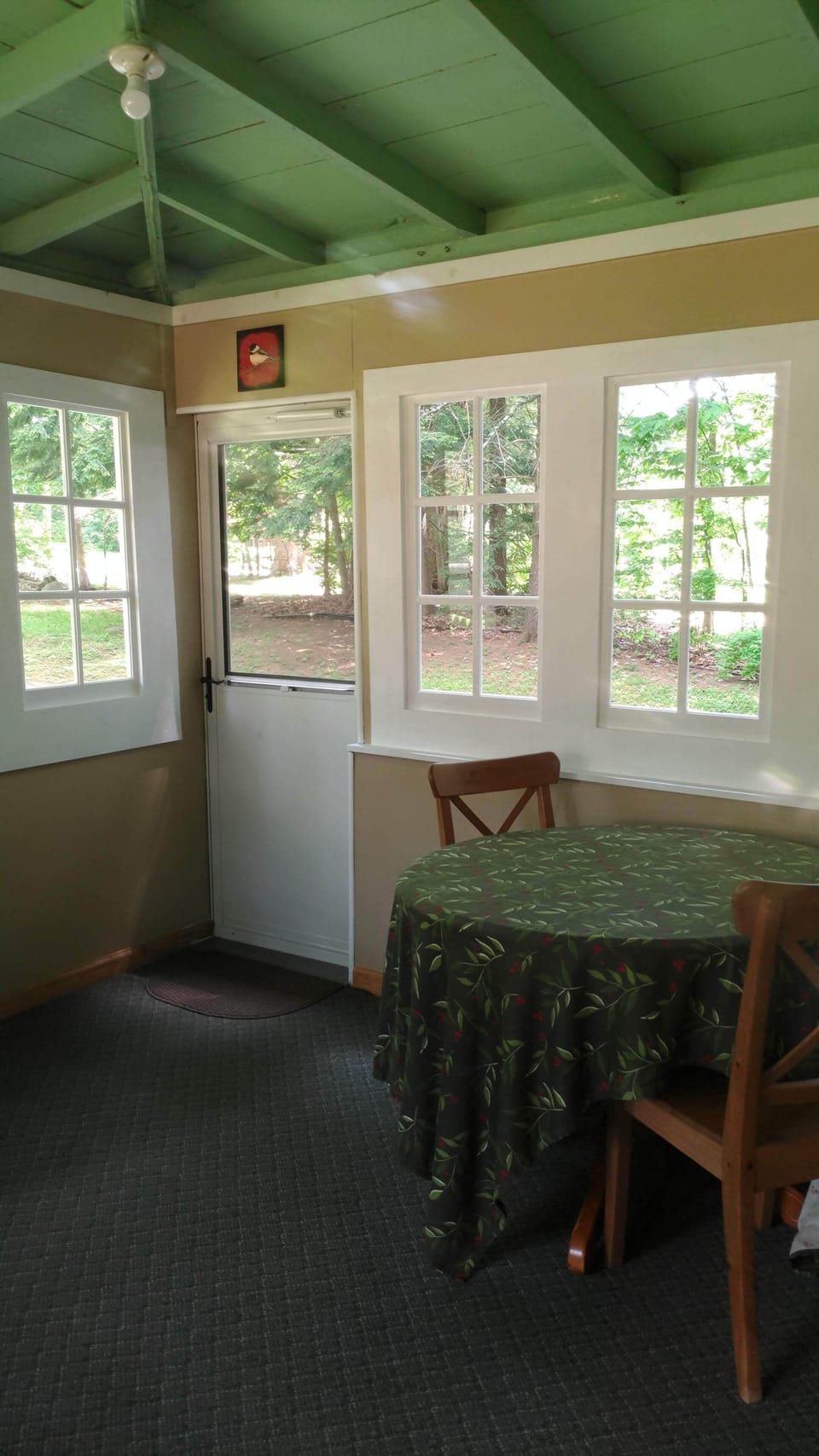 Have your morning coffee or play a game of cards in the enclosed front porch