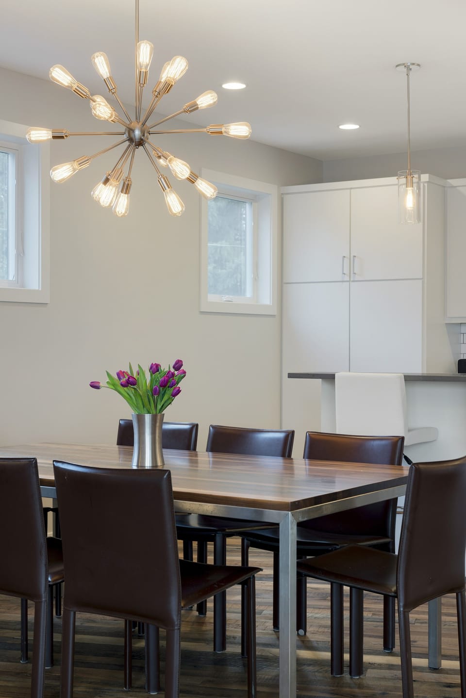 Gather around your modern dining table under the stunning starburst chandelier for memorable meals with loved ones.