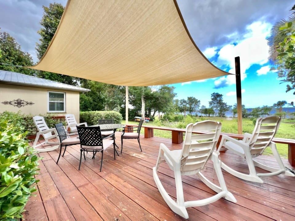 Large outdoor deck with landscape lights for nighttime enjoyment.