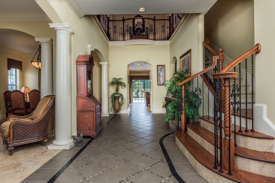 Grand entrance hallway with high ceiling 