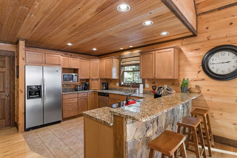 Granite Counter Tops and Bar Seating in the Kitchen