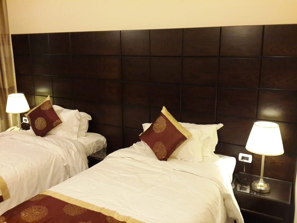 Double or Twin Room, Smoking, City View | Living room | TV