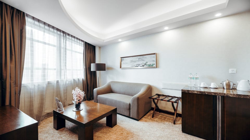 Suite, 1 King Bed | Minibar, in-room safe, soundproofing, iron/ironing board