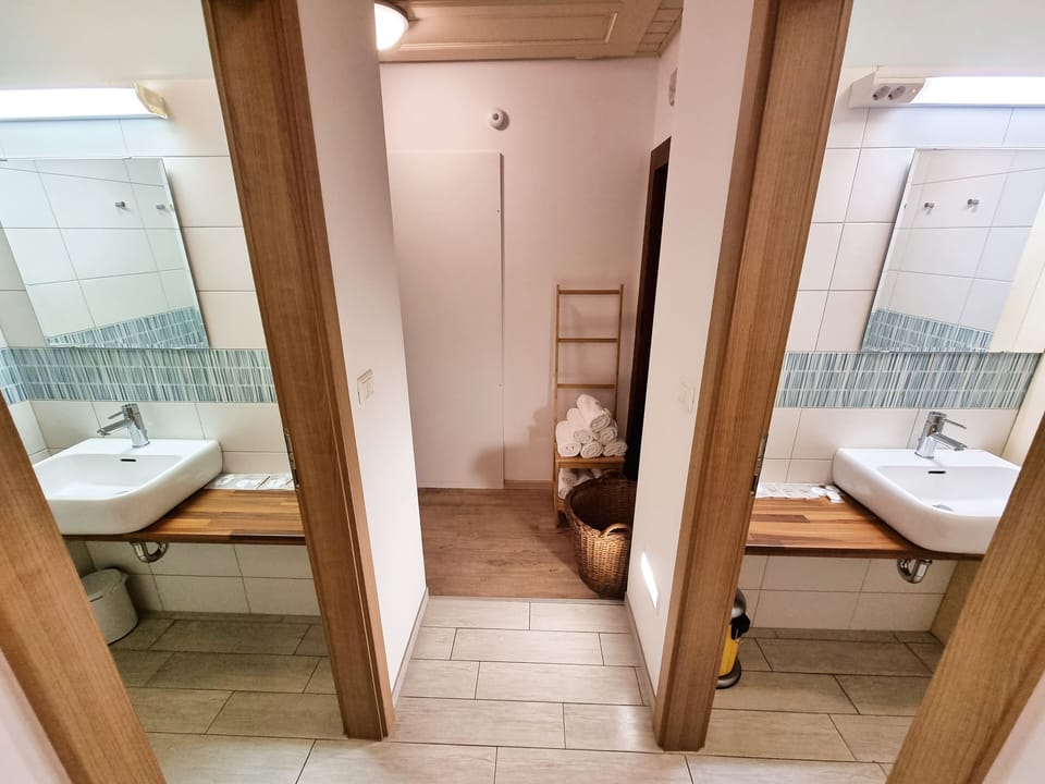 Family Quadruple Room, 6 Bedrooms | Bathroom | Shower, free toiletries, hair dryer, towels