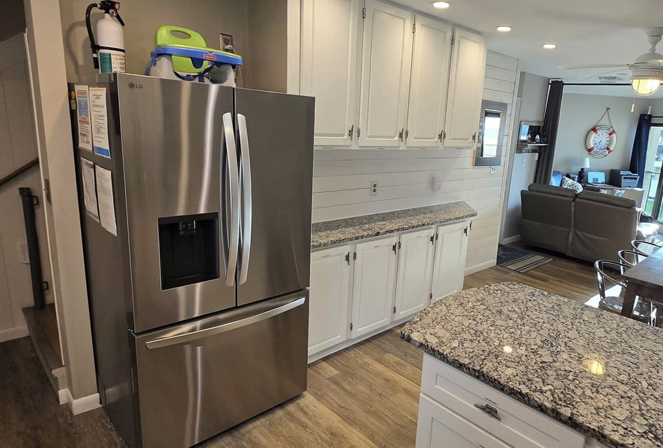 Large refrigerator, lots of cabinets & counter space, baby seat provided.