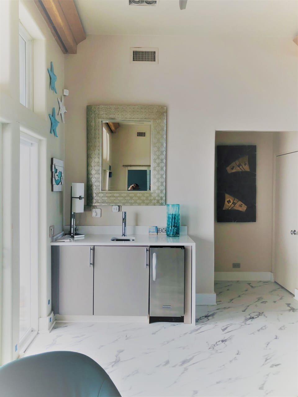 Wet Bar w/sink & icemaker (serviced annually), updated w/quartz counter in 2021