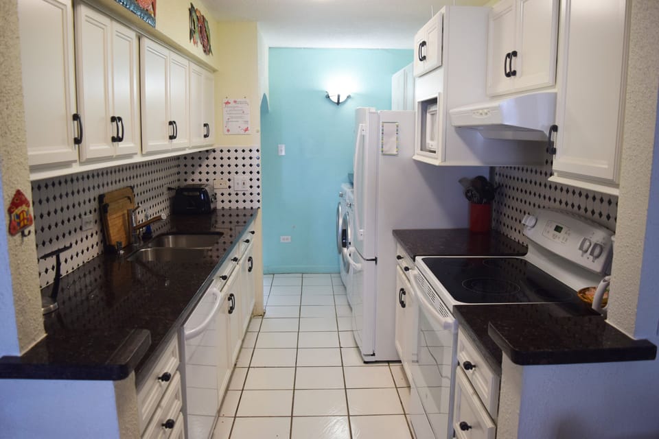 A fully-equipped kitchen with new appliances.