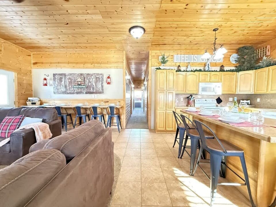View from the entryway highlighting the open concept of kitchen and living area.