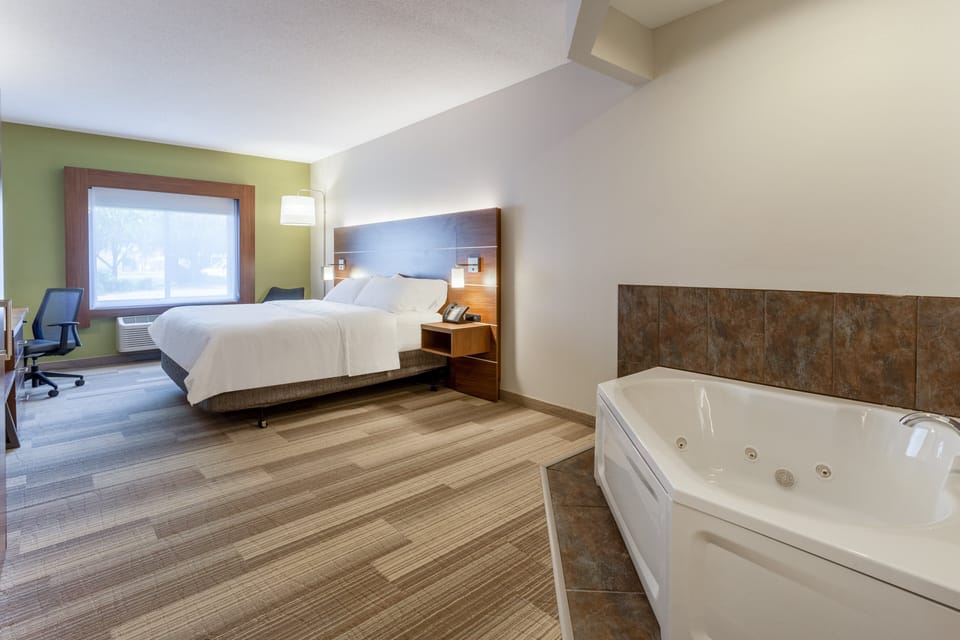 Suite, 1 King Bed, Jetted Tub | In-room safe, desk, blackout drapes, iron/ironing board
