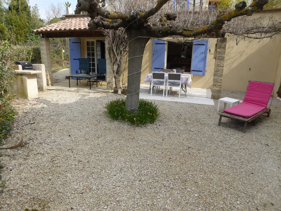 Outside seating and dining area with lounger