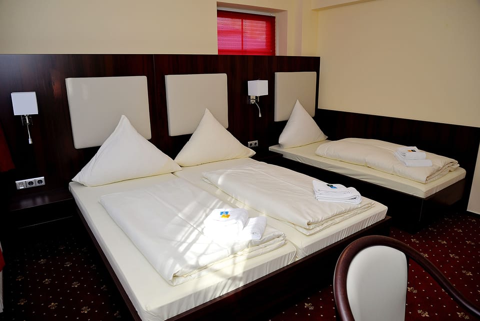 Triple Room | Premium bedding, minibar, desk, blackout drapes