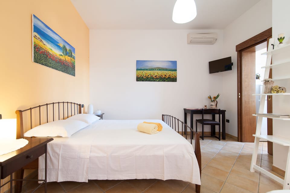 Superior Triple Room, Kitchen | Desk, laptop workspace, blackout drapes, soundproofing