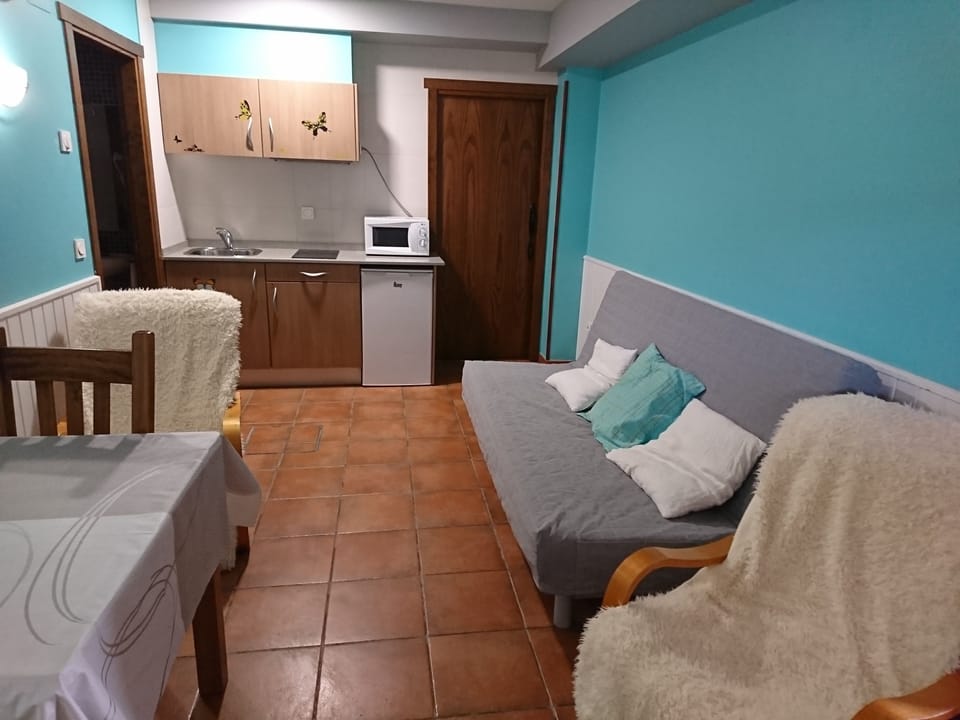 Apartment, 1 Bedroom, Balcony, Garden View | Living area | Flat-screen TV