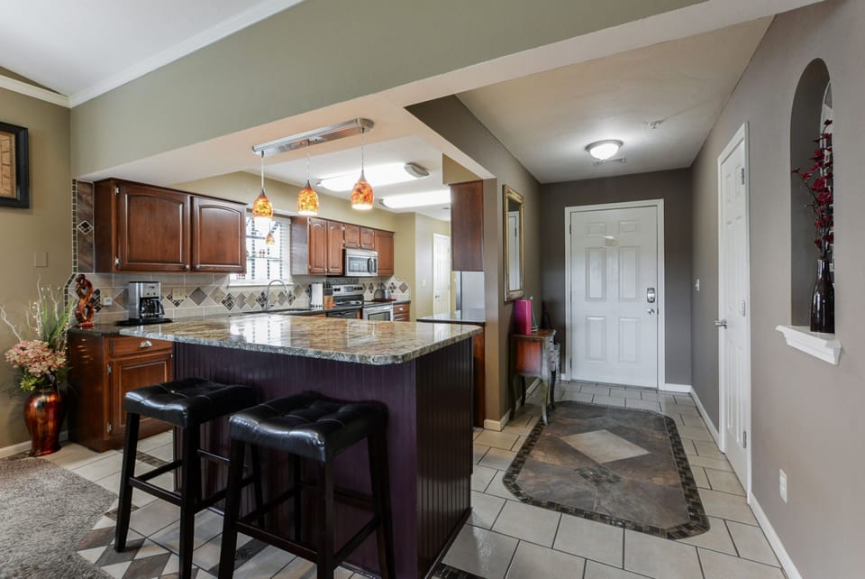 Entry, bar area, and kitchen