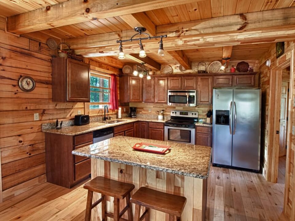 Kitchen with Stainless Steel Appliances Eat In Breakfast Bar.