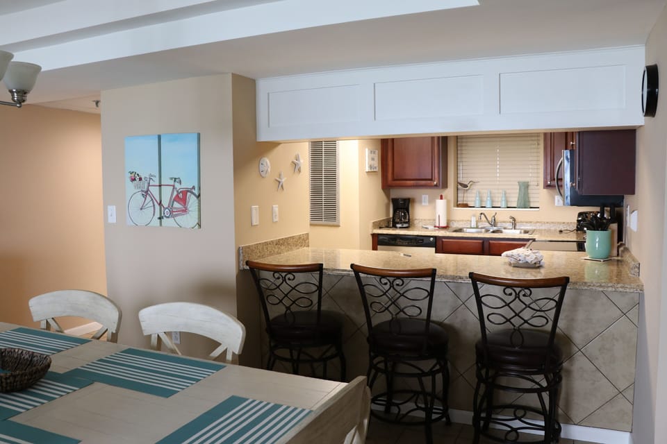 View into kitchen area from dining
