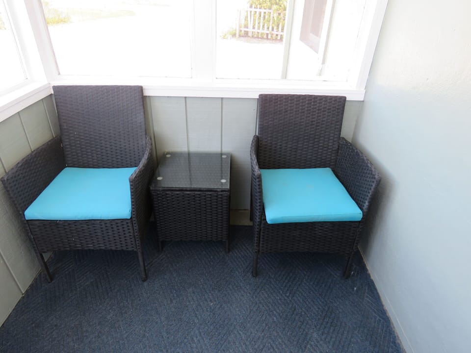 Relax inside the screened in porch 
