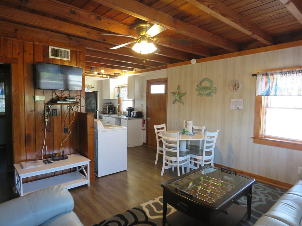 Living room area has a smart tv and cable 