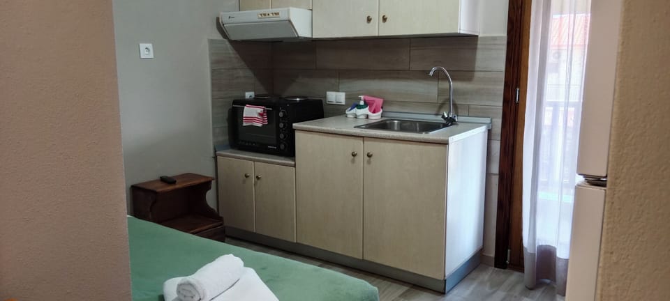 Family Apartment, Balcony, Sea Facing | Private kitchenette | Electric kettle