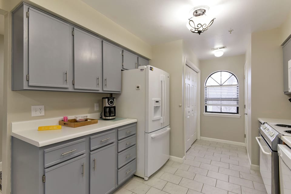 Kitchen area with nice french door refrigerator with ice maker.