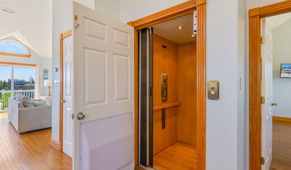 Surf or Sound Realty - 427 - Just Beachy - Elevator - Label