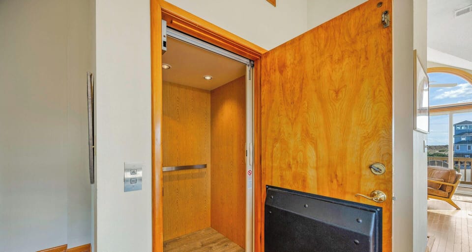 Surf or Sound Realty - 753 - Longview - Elevator - Label