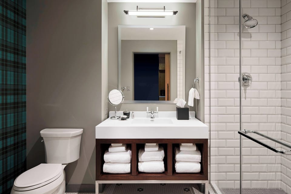 Designer toiletries, hair dryer, bathrobes, towels