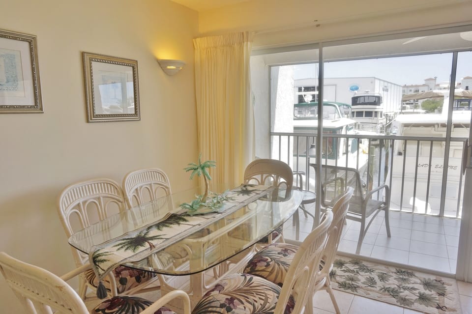 Dining Area looking out over the Screened Lanai and the Marina
