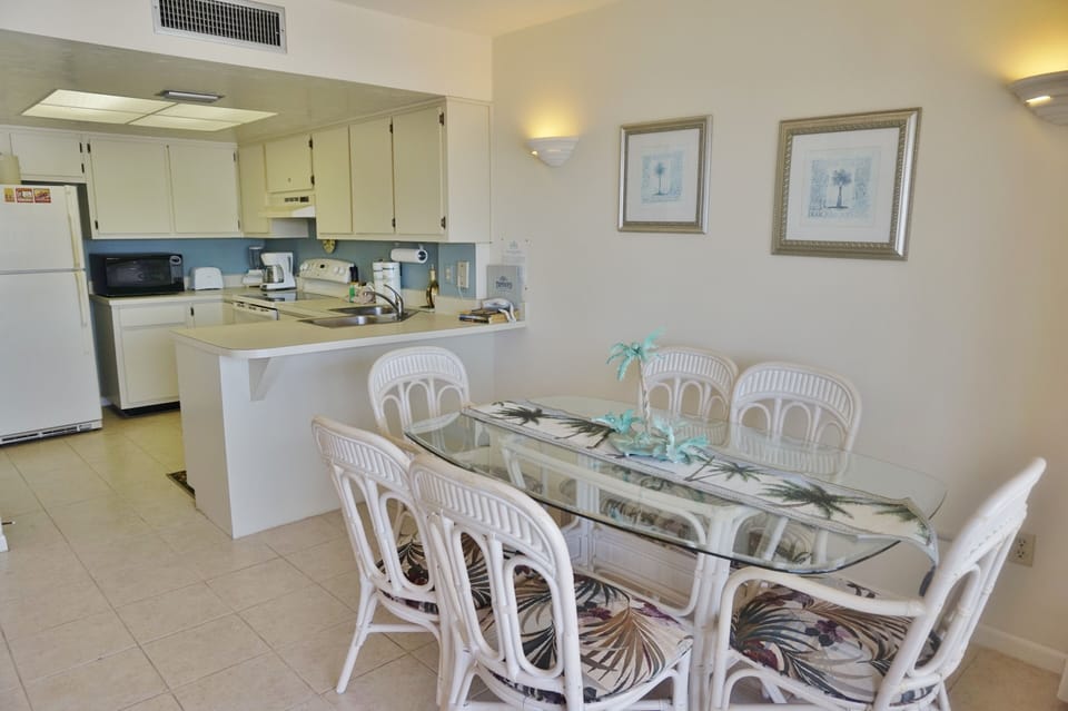 Dining Room  Area with a Glass Top, 6 Chair Table Set