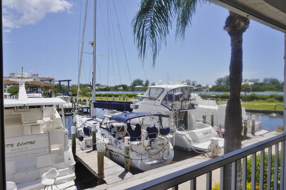 The Screened Lanai overlooks the boats in the Marina