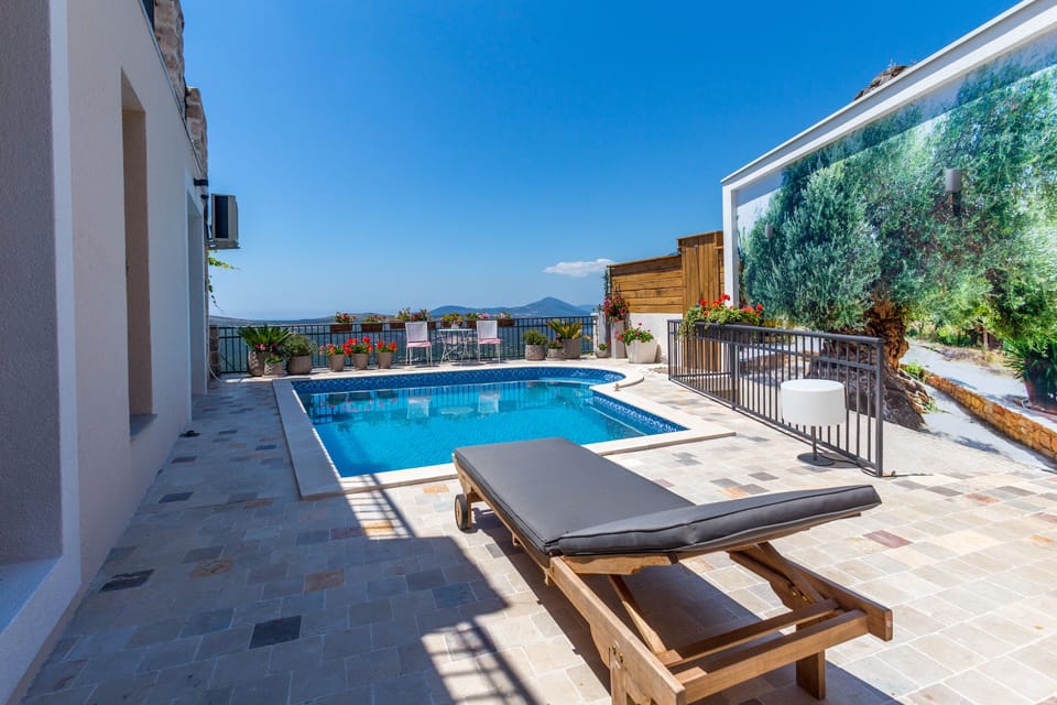 Pool With Boka Bay and Sea and Mountain View.