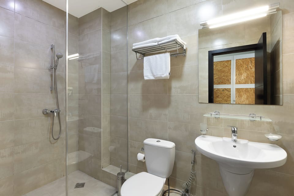 Economy Double or Twin Room | Bathroom | Shower, free toiletries, hair dryer, bathrobes