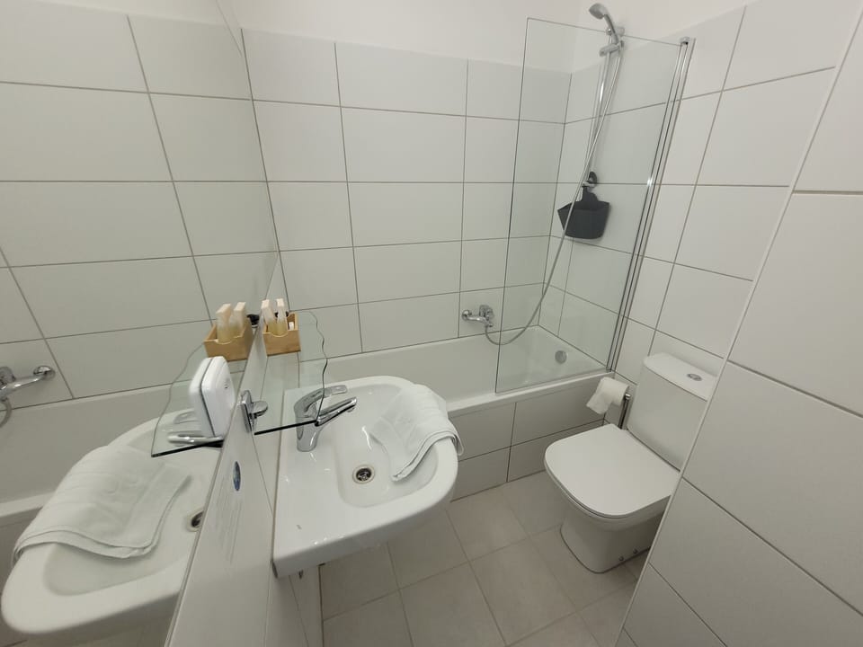 Standard Double or Twin Room, Refrigerator | Bathroom | Free toiletries, hair dryer, towels