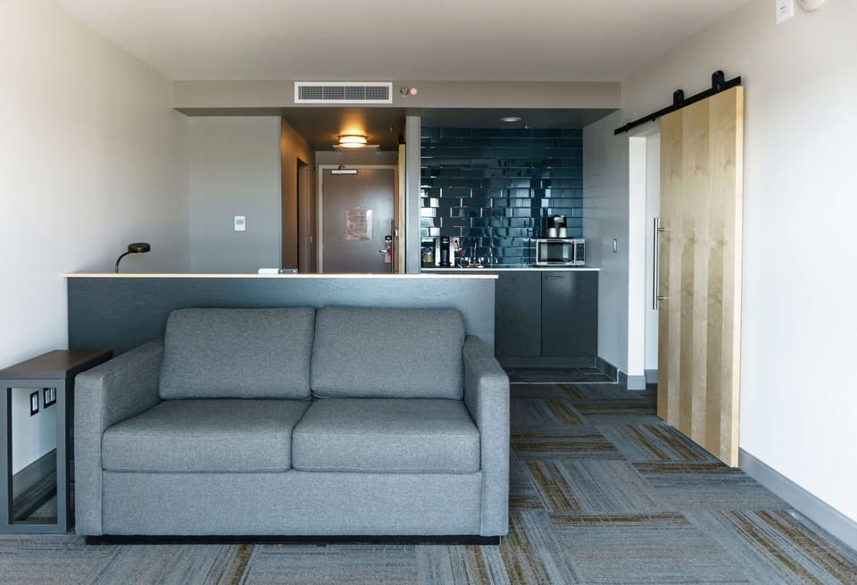 Suite, 1 Bedroom (1 King Bed) | Living area | 55-inch TV with cable channels, pay movies