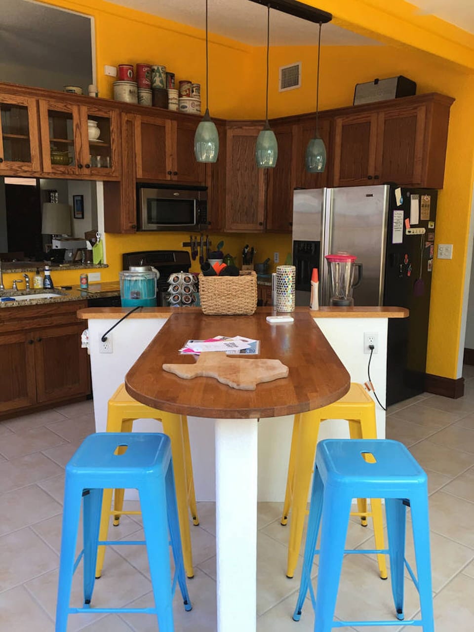 Fully stocked kitchen with breakfast bar with 4 steel stools - party room.