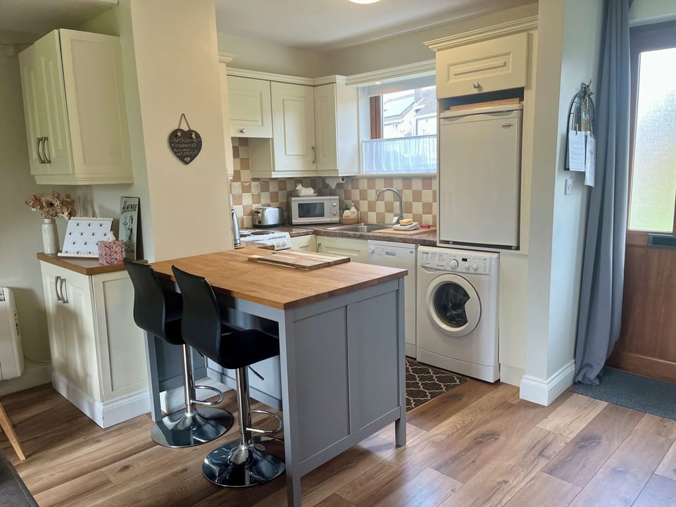 Full kitchen with everything you’ll need to prepare meals. Wash machine included