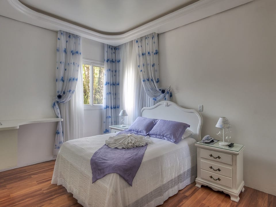 Double Room | Minibar, individually decorated, desk, blackout drapes