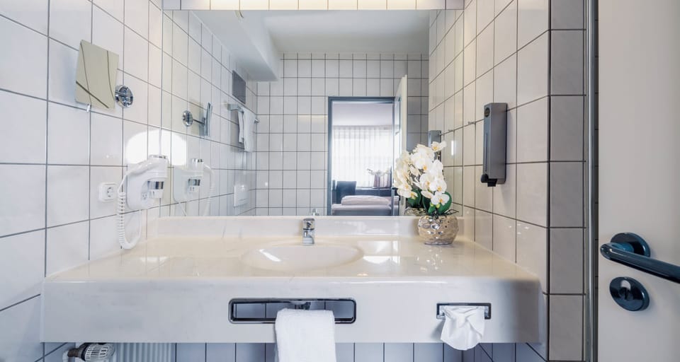 Bathtub, hair dryer, towels, soap