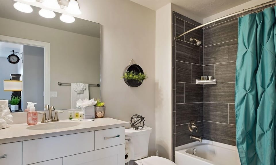 Third master suite bath featuring a tub and shower combo