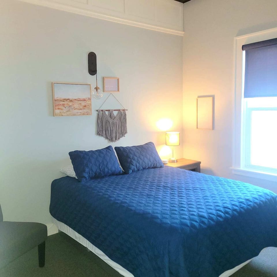 8 rooms on the top level have queen beds, TV's, dressers and all linens. 
1 bedroom has a set of twin bunk beds. 2 full bathrooms on the upper level with washer and dryer on both levels. 