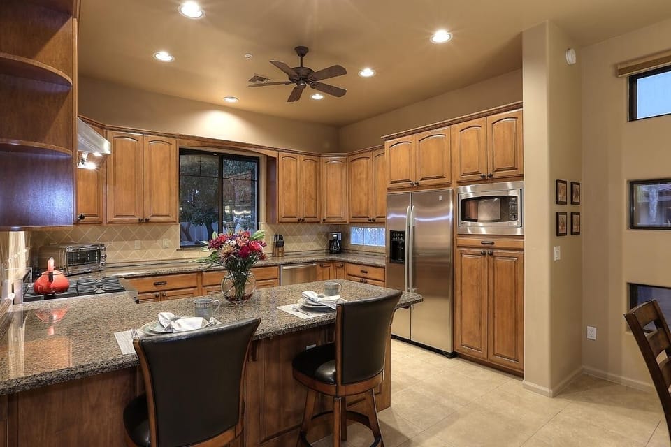 Kitchen With Viking Gas Range And Stainless Appliances