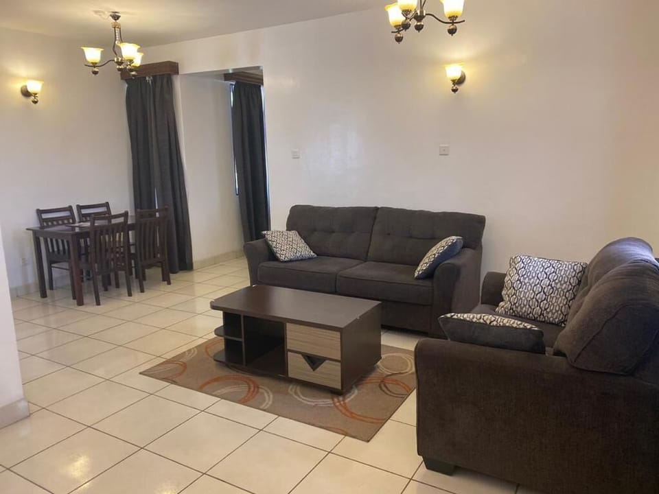 Executive Apartment | Living area | TV