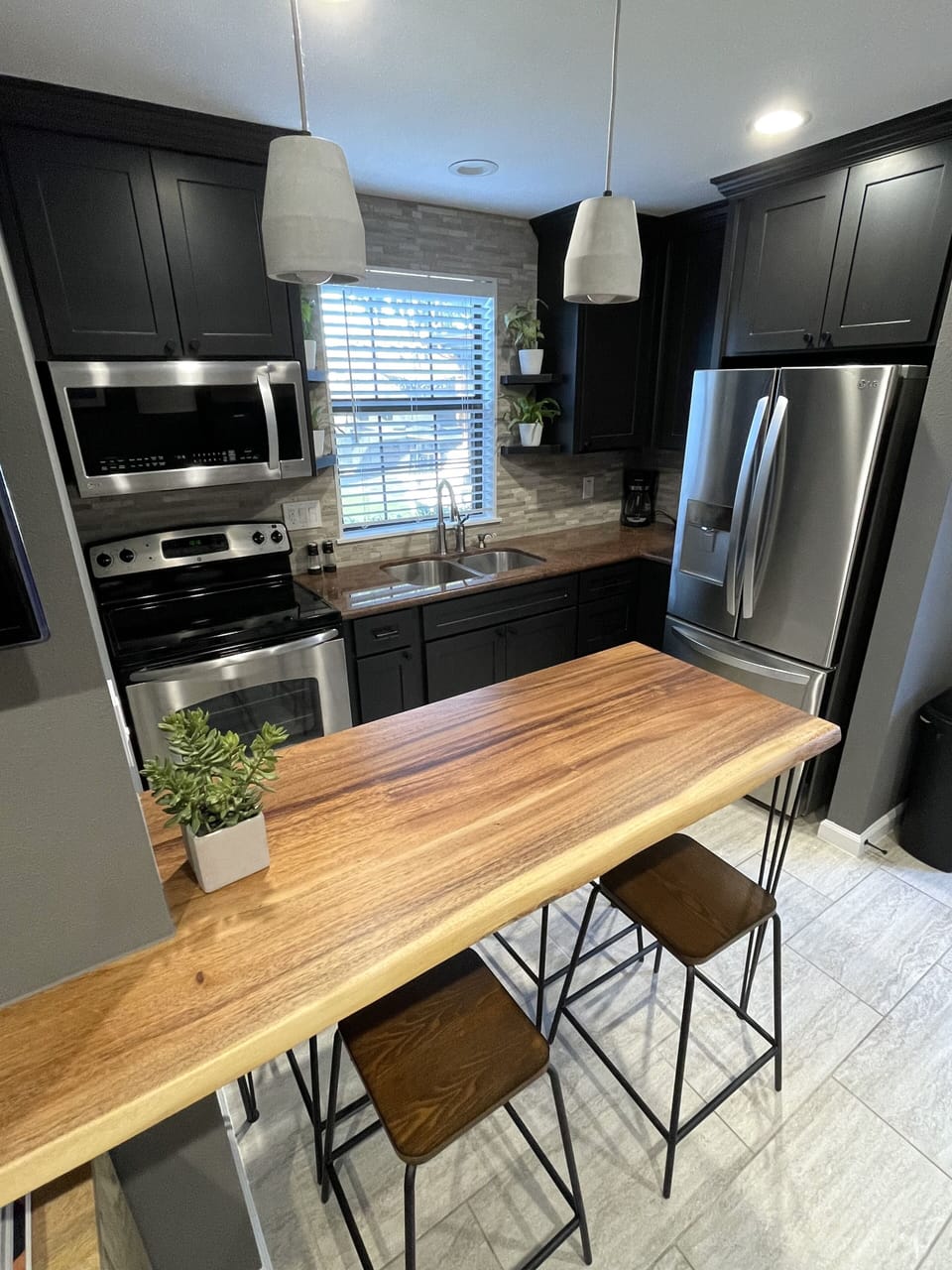 Kitchen view with 4 bar stools