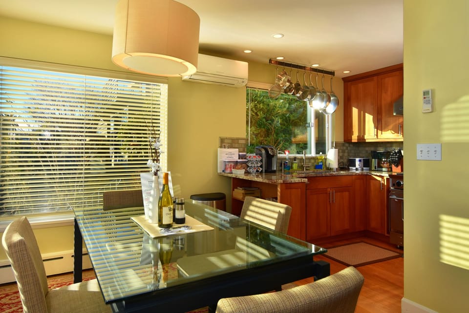 Dining area looks into your Gourmet kitchen which is stocked with cookware.