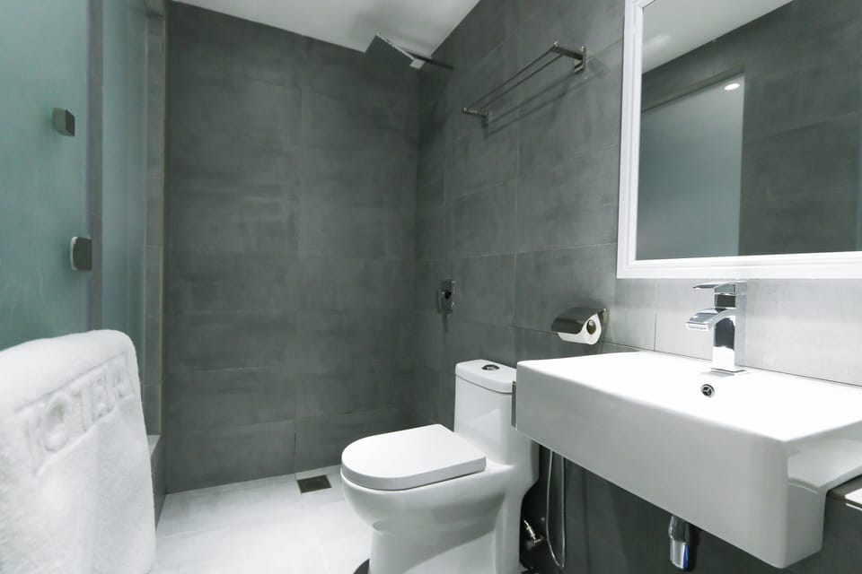 Standard Queen  | Bathroom | Shower, free toiletries, hair dryer, slippers